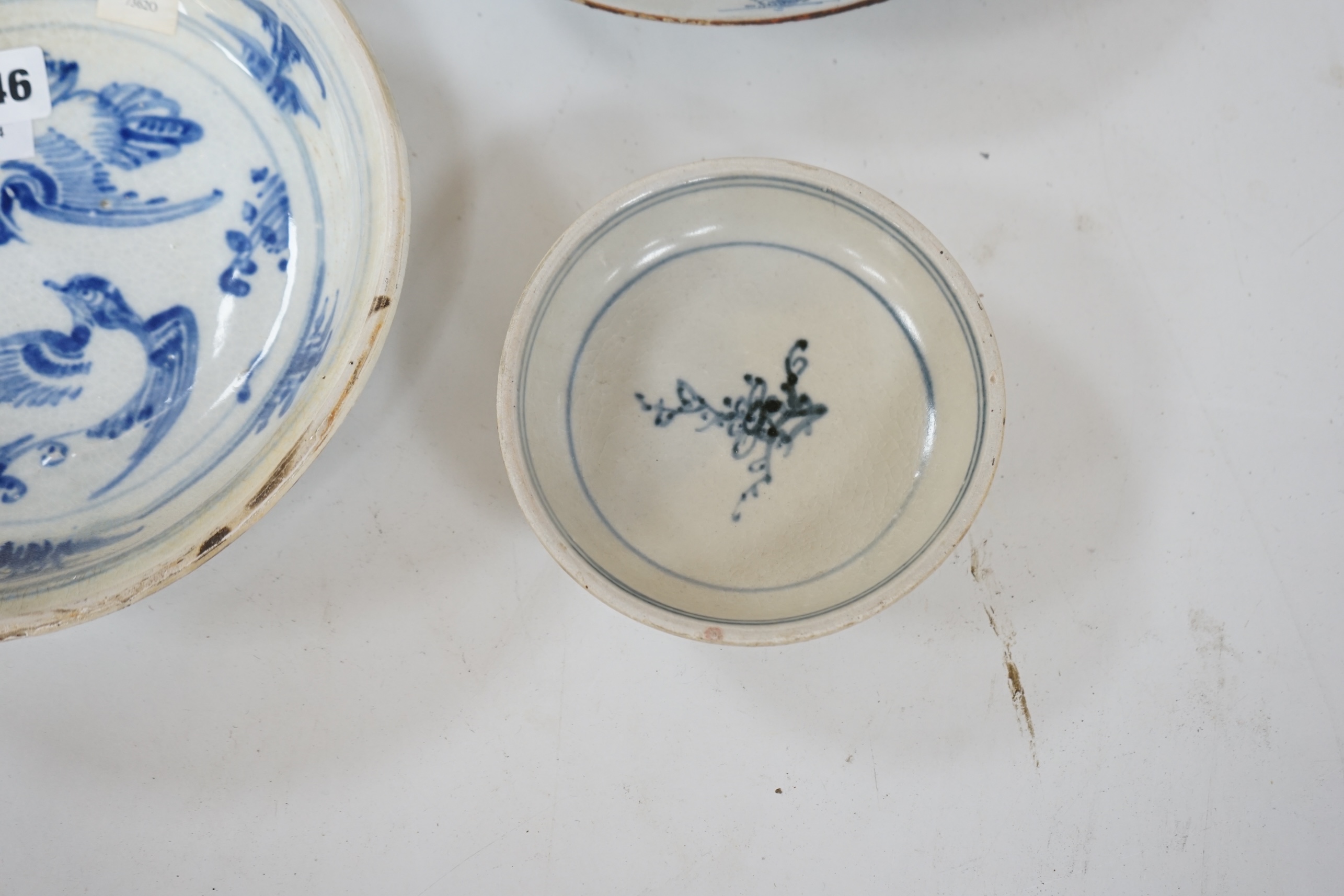 Three 15th century pieces from the Saga Visal Hoi-an hoard Vietnamese shipwreck and a delft dish, 26cm. Condition - commensurate with age